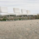 4 chauffeuses formant canapé modulable. acier, simili-cuir, années 70