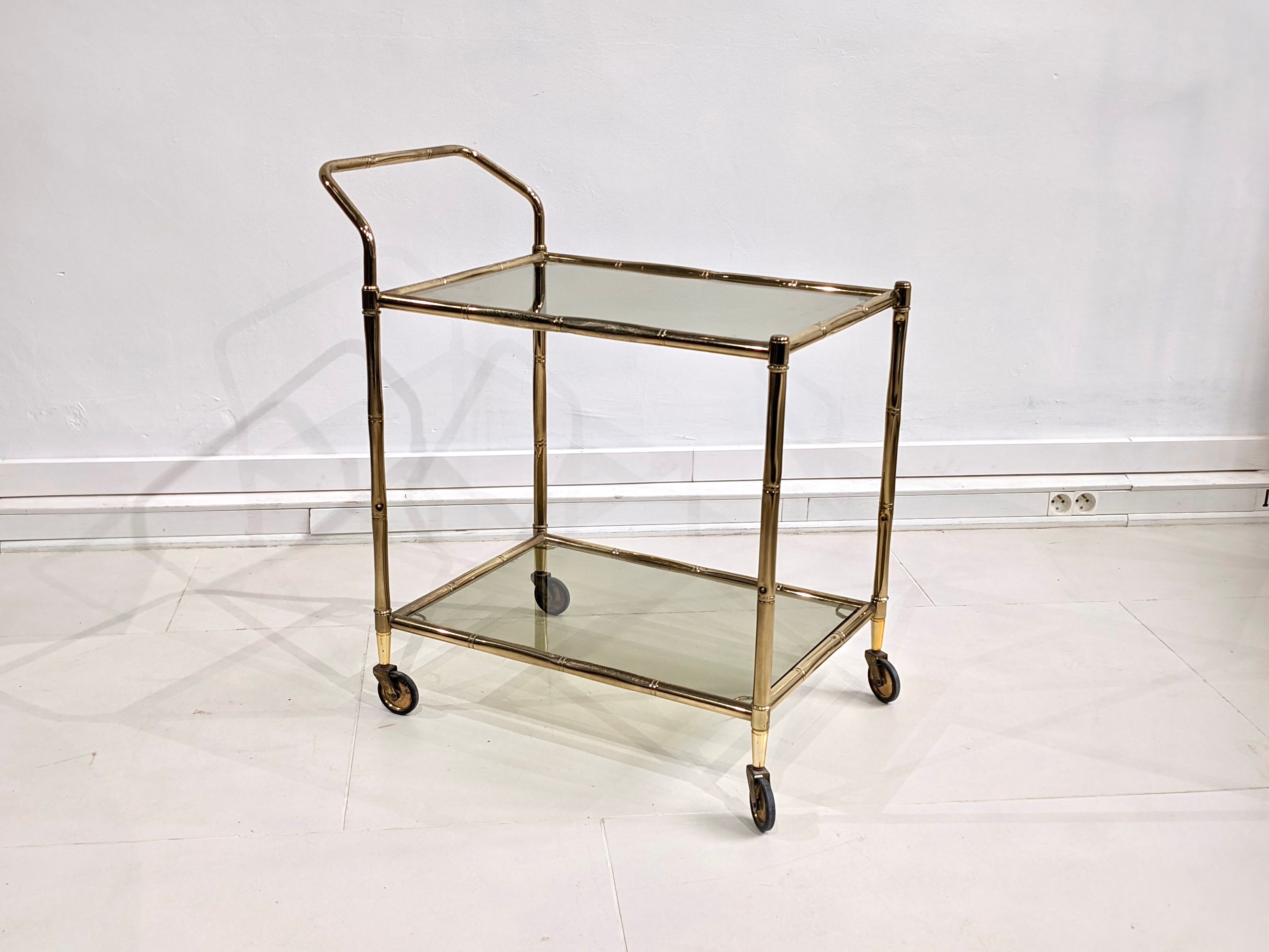 Golden metal dessert with tinted glass tops