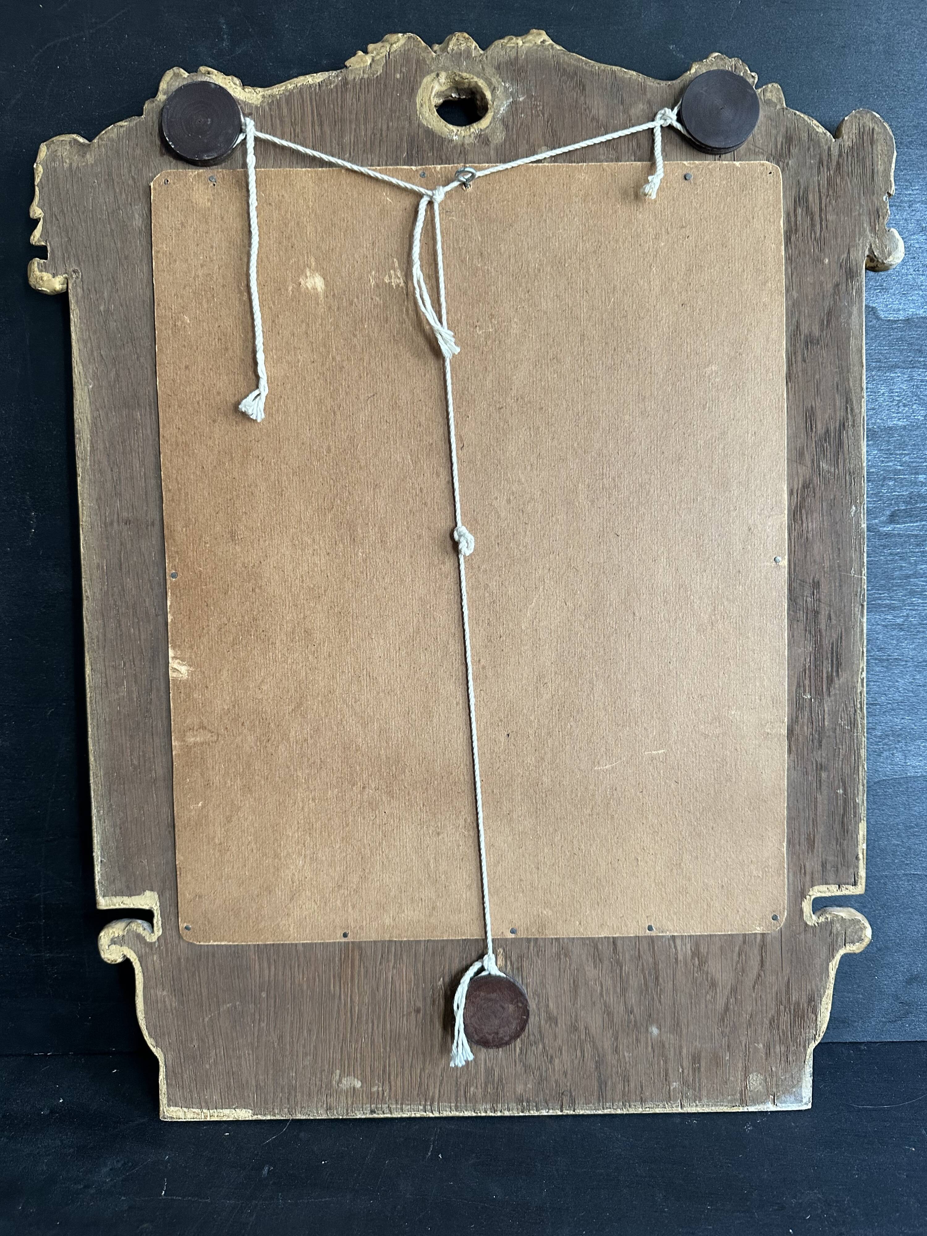 Napoleon III mirror in carved gilded wood, oval mercury glass.