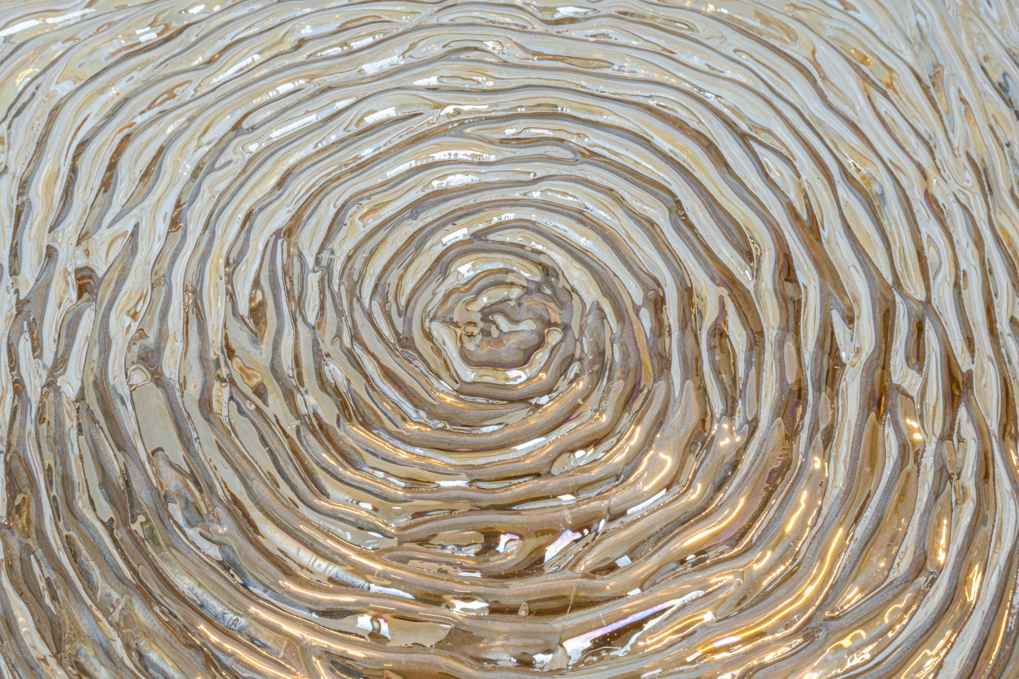 Amber glass wall light in the shape of a fingerprint, Germany, 1970s.