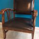Fauteuil bois et cuir style colonial