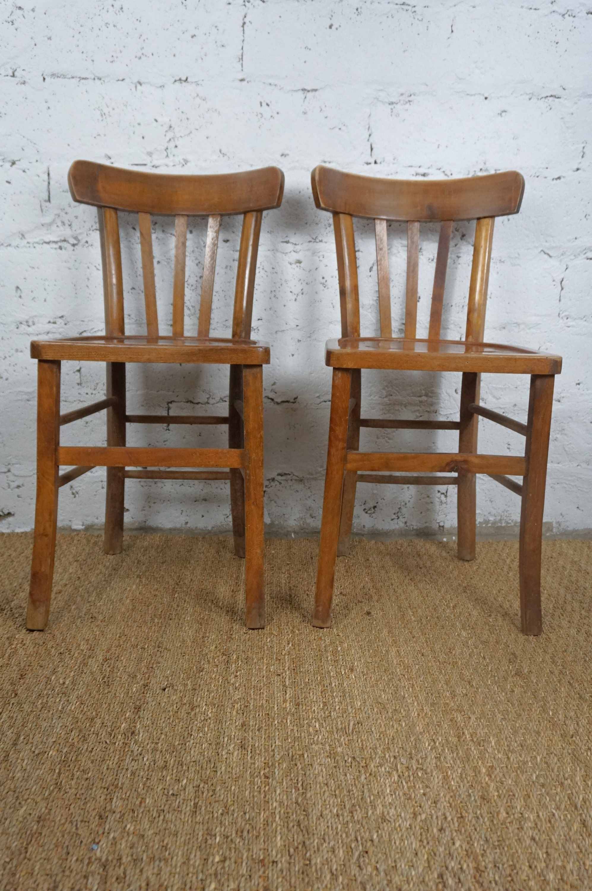 pair of vintage wooden bistro chairs