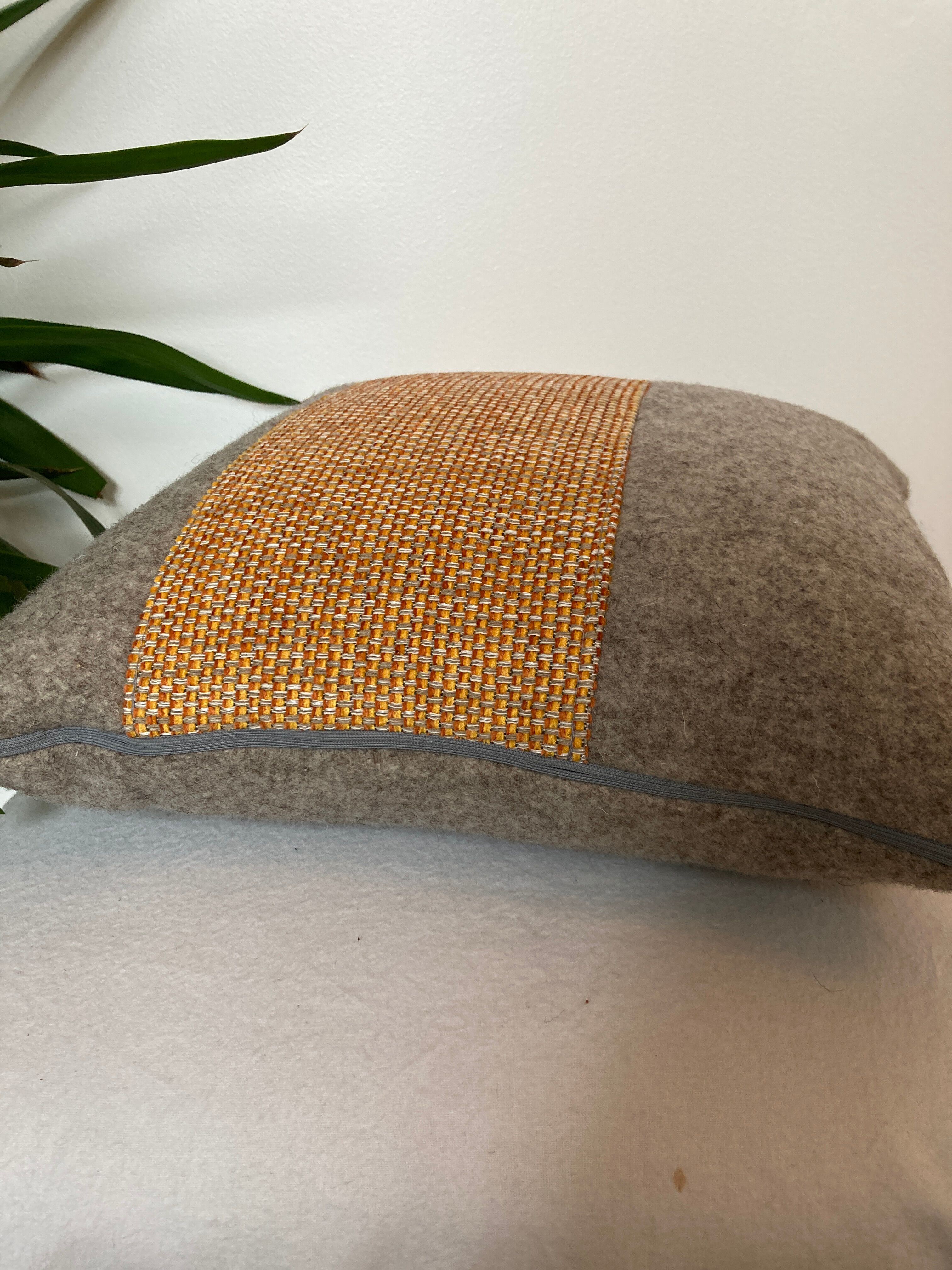 Bi-sided cushion gray wool yoke orange fabric