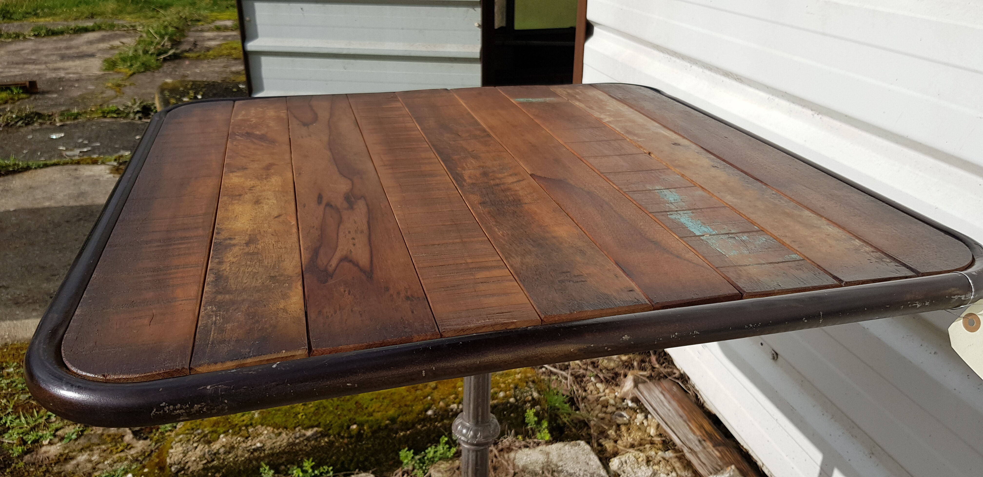 Wooden tray bistro table with old cast iron base