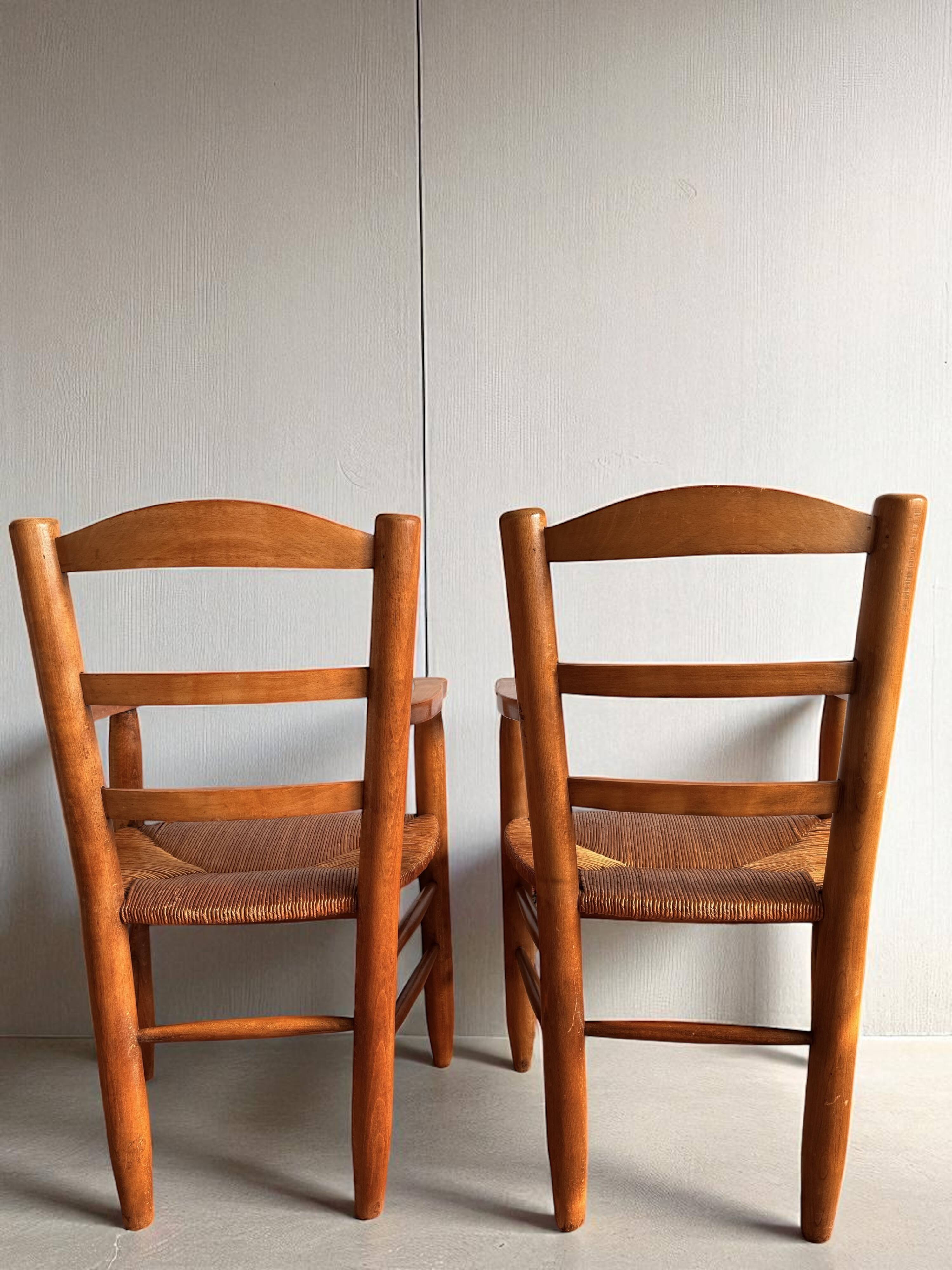 Pair of vintage armchairs in solid wood and straw – Georges Robert