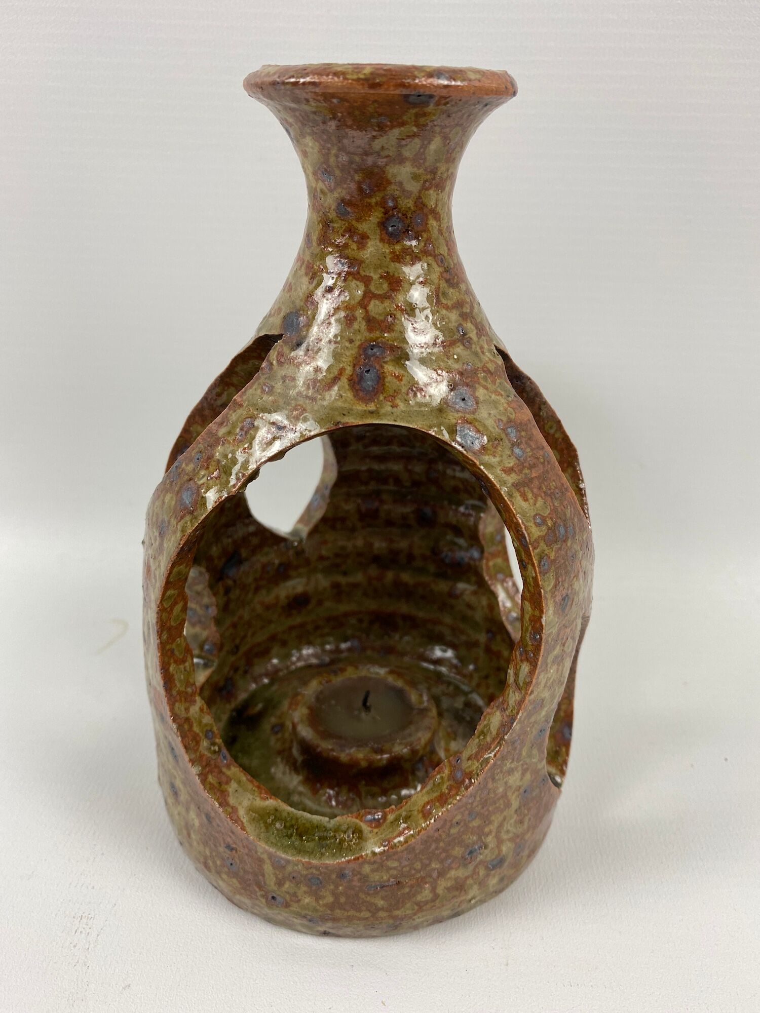 Hand-held sandstone candlestick