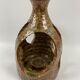 Hand-held sandstone candlestick
