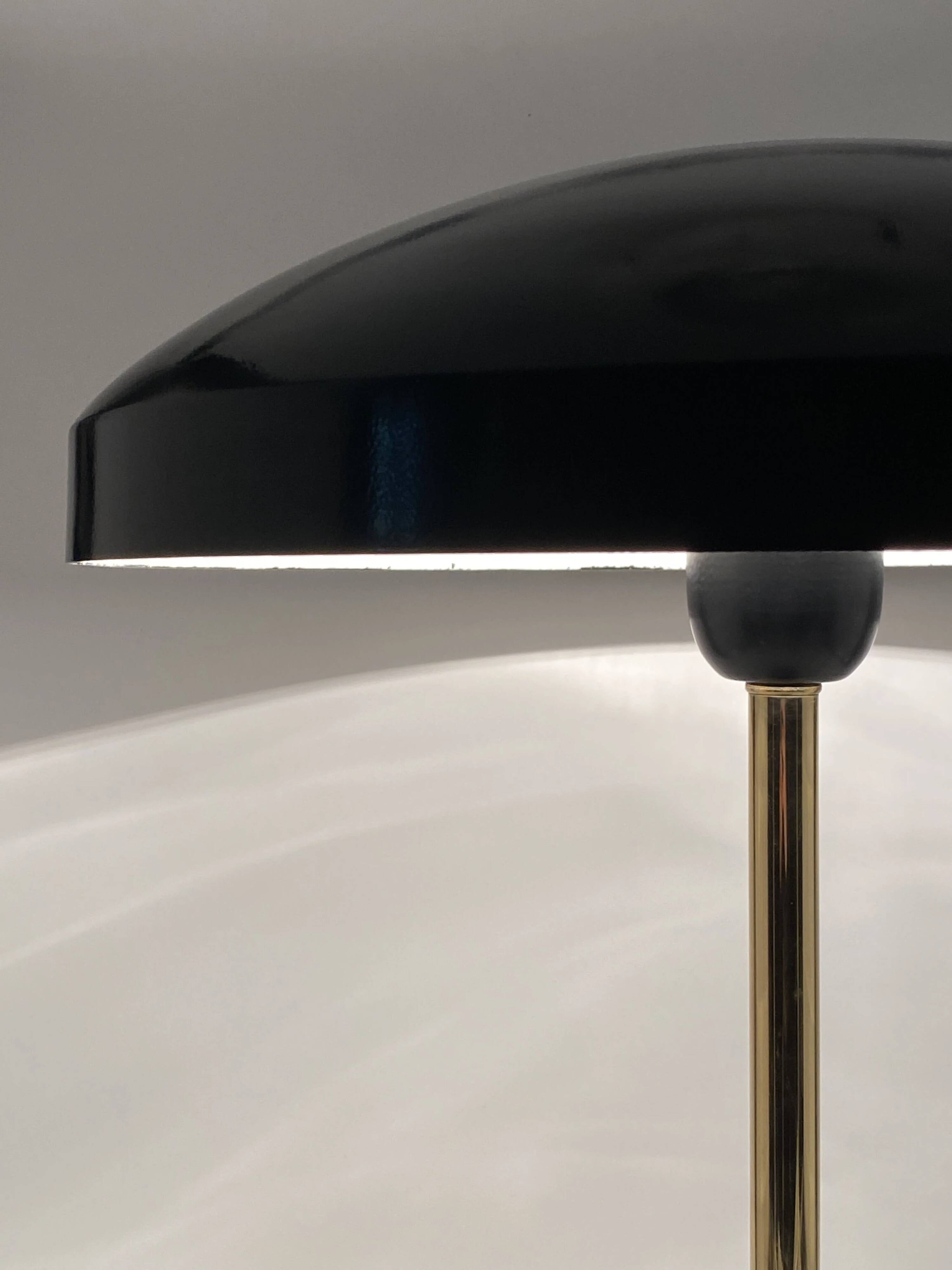 Rare black and gold UFO table lamp by Louis Kalff for Philips.
