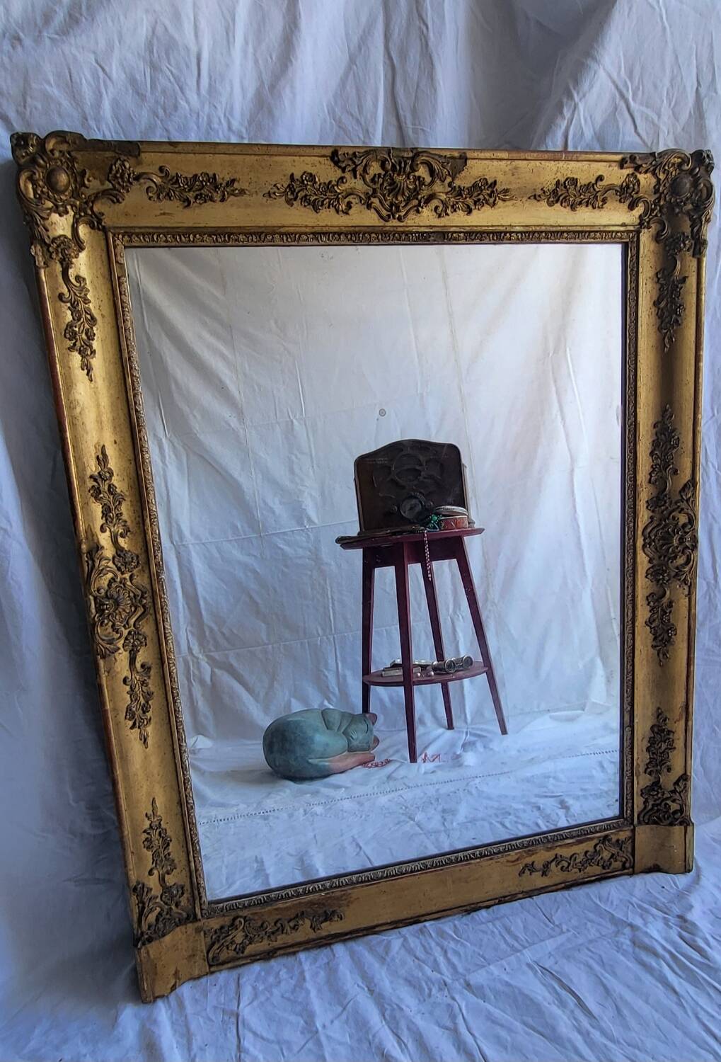 Antique Louis Philippe style gilded mirror decorated with floral motifs