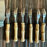 6 bamboo forks and a pie server