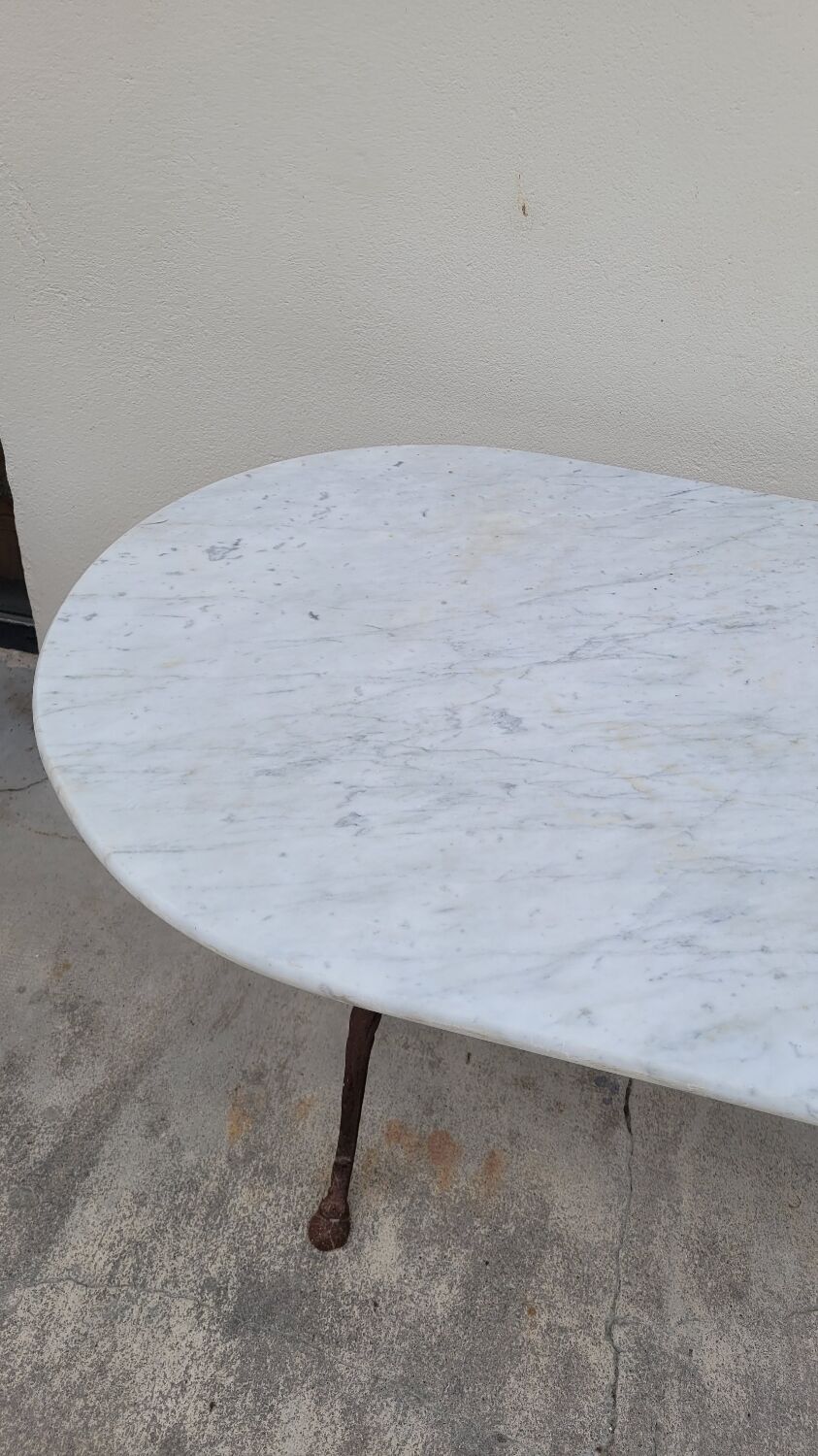 Restaurant bistro table in oval marble and decorated cast iron bases -1m51