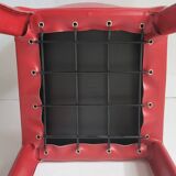 Red leather dining chairs by Arper