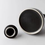 Vintage ceramic teapot from the 1980s, black with white stripes and a metal handle.