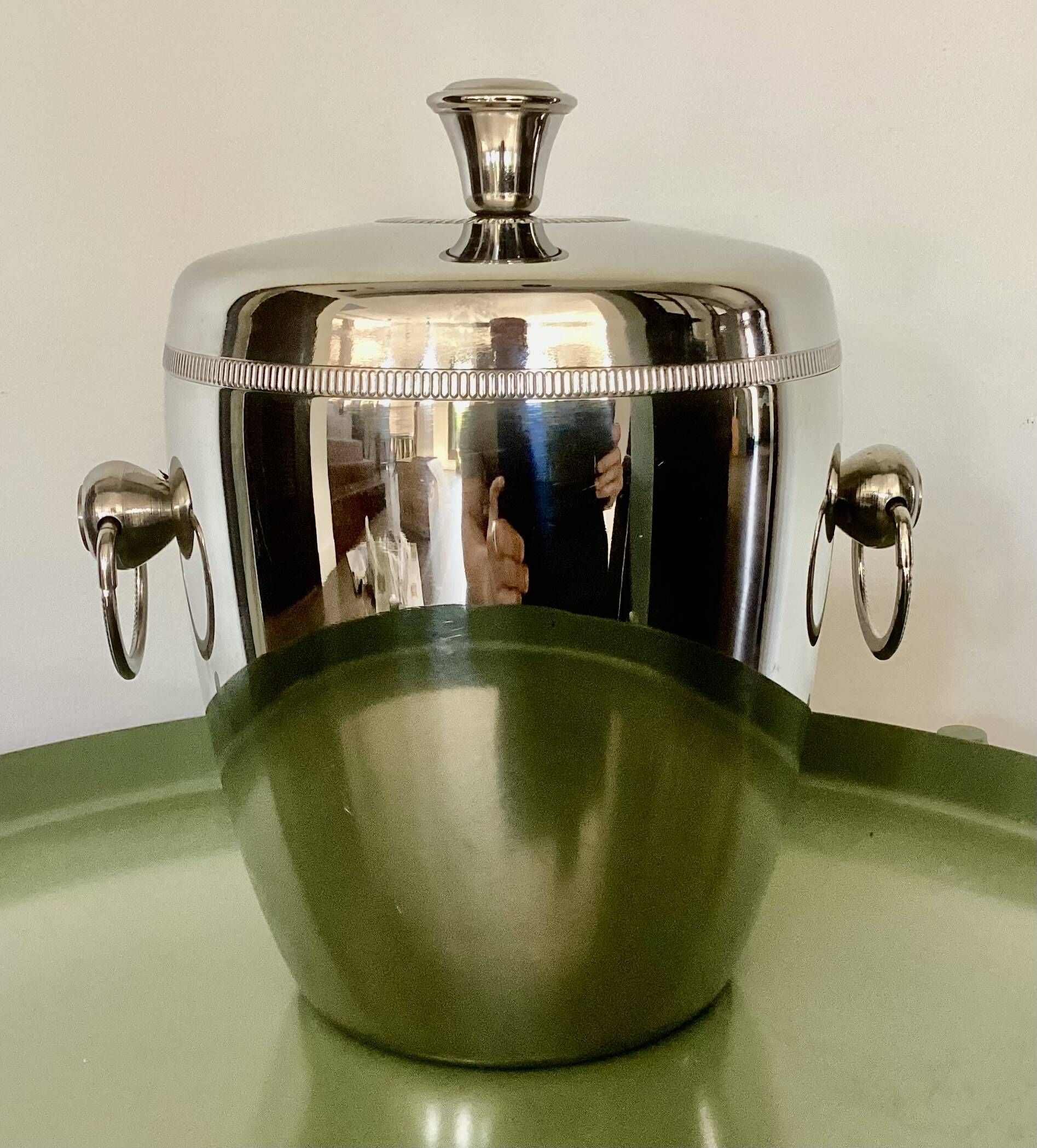 Vintage silver-plated ice bucket with lid and handles.