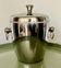Vintage silver-plated ice bucket with lid and handles.