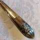 Silver cake shovel filled with silver metal