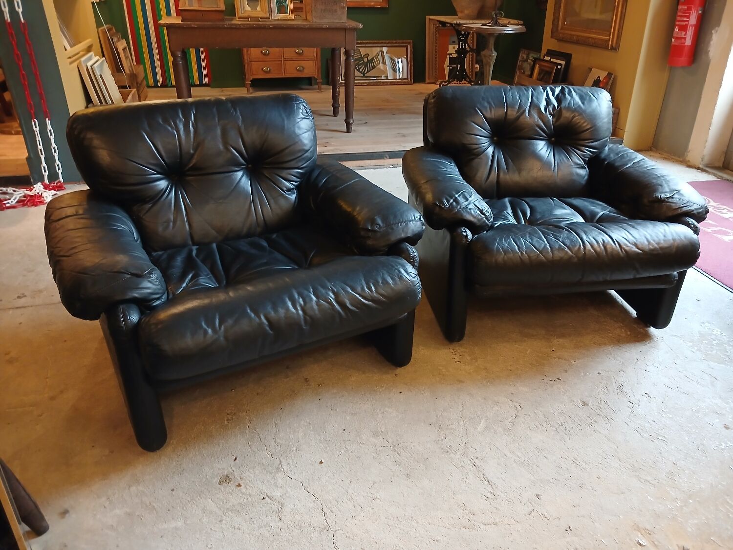 Pair of designer leather armchairs by Tobia Scarpa