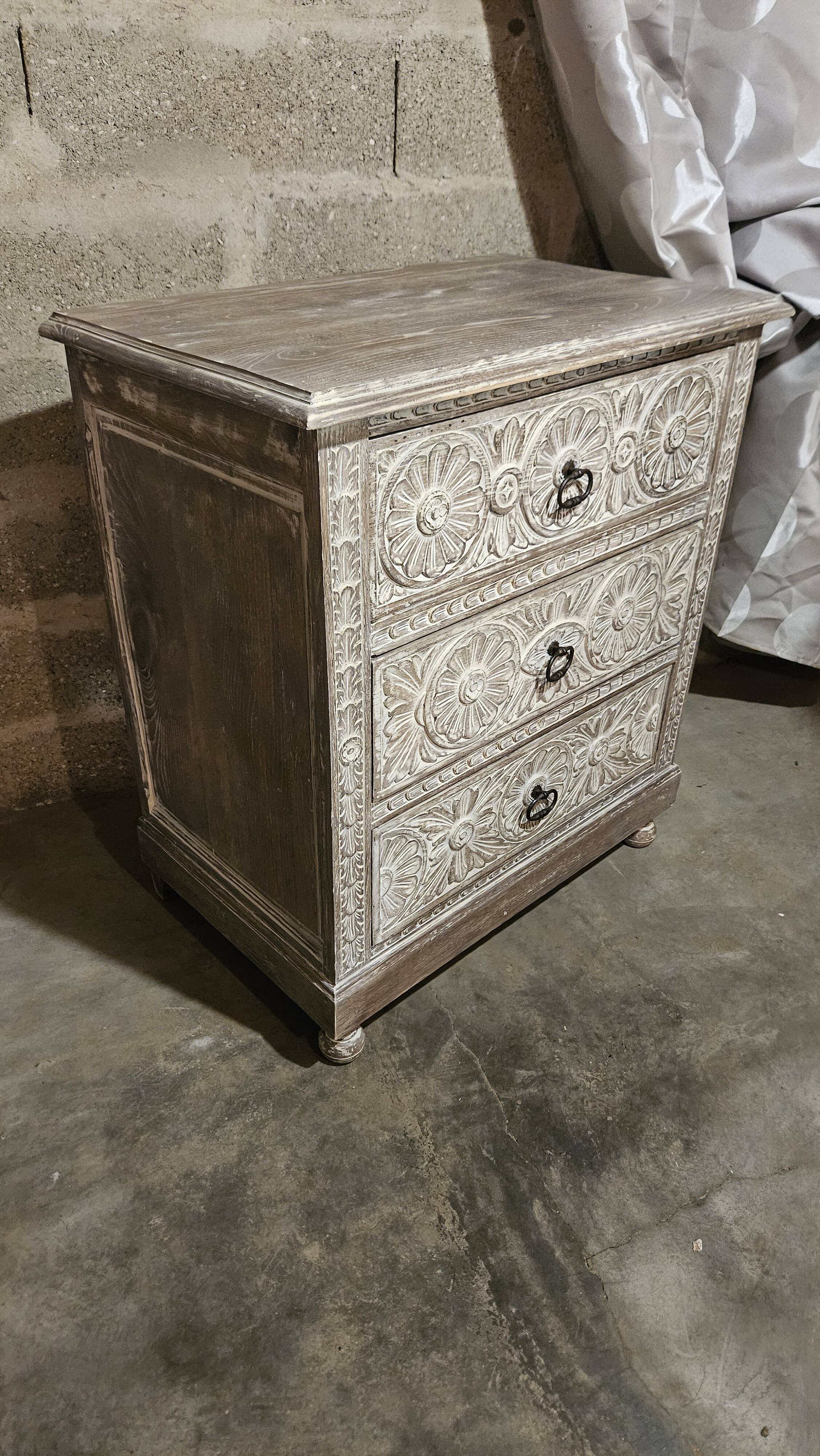 Carved chest of drawers
