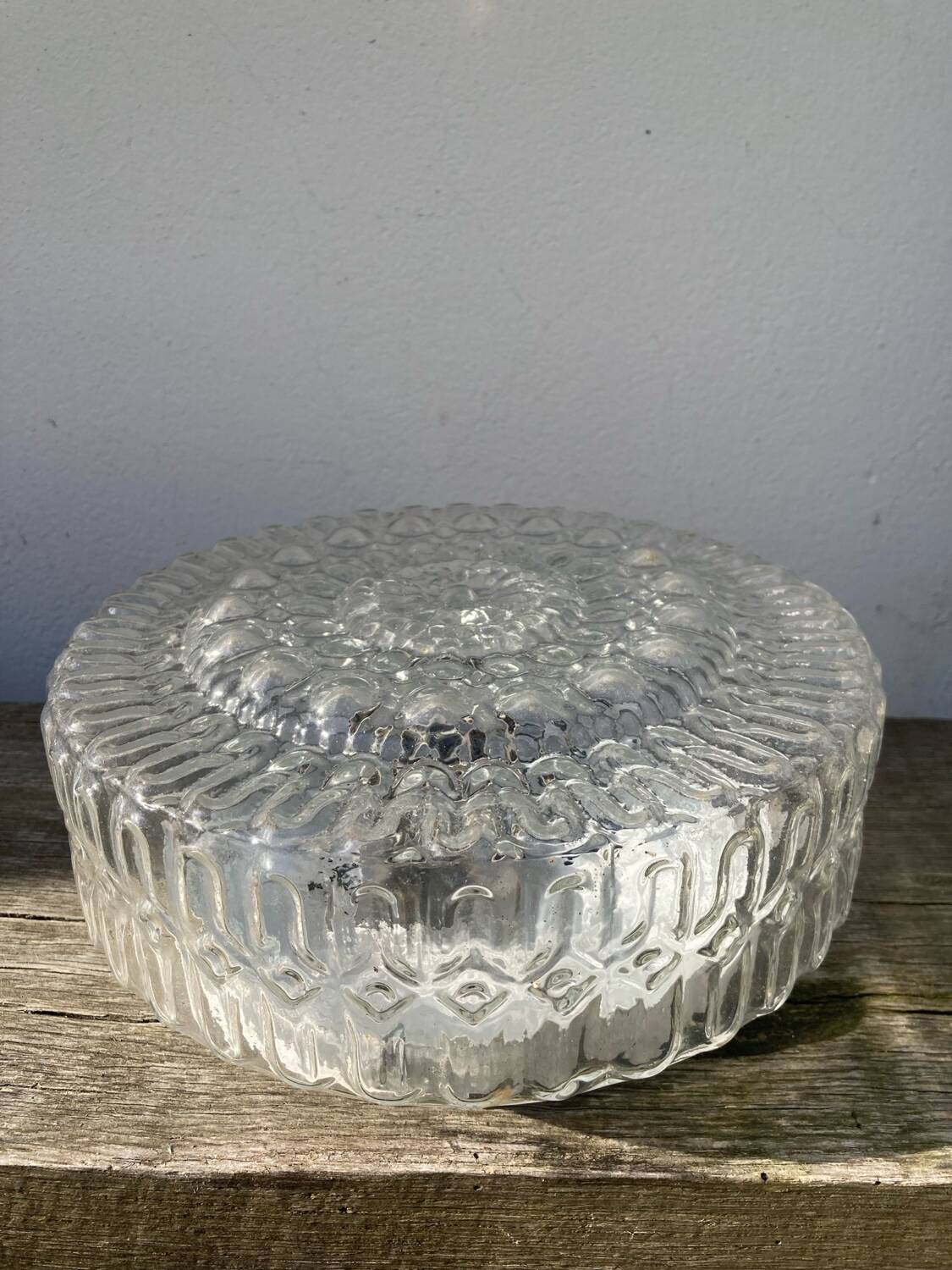 Pair of transparent round glass wall lights