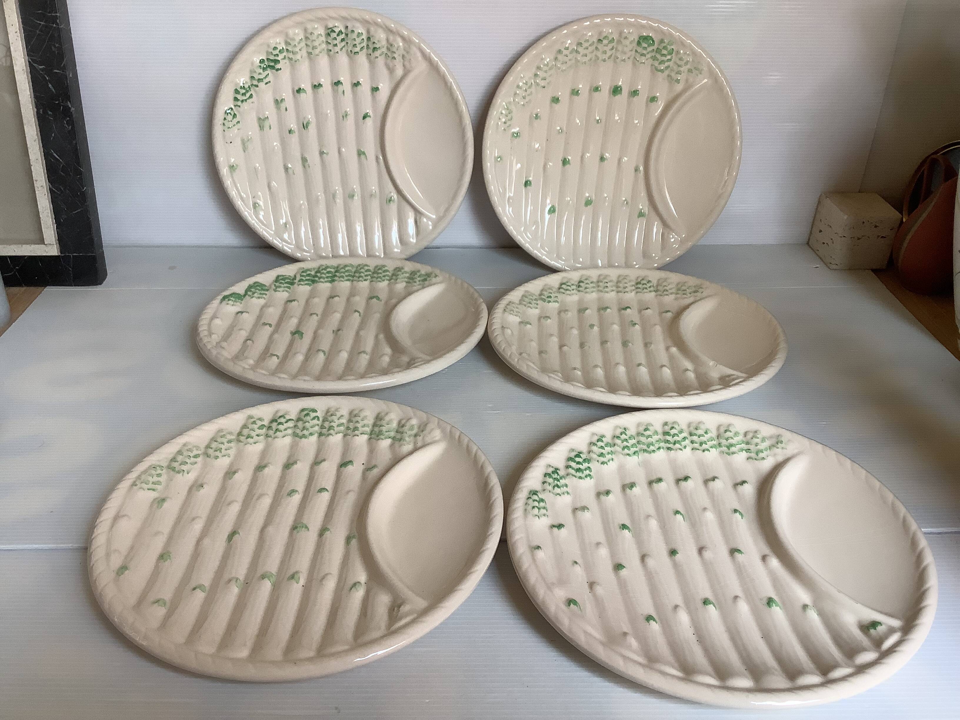 Six antique asparagus plates