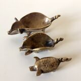 Stackable ashtrays in the shape of a pig