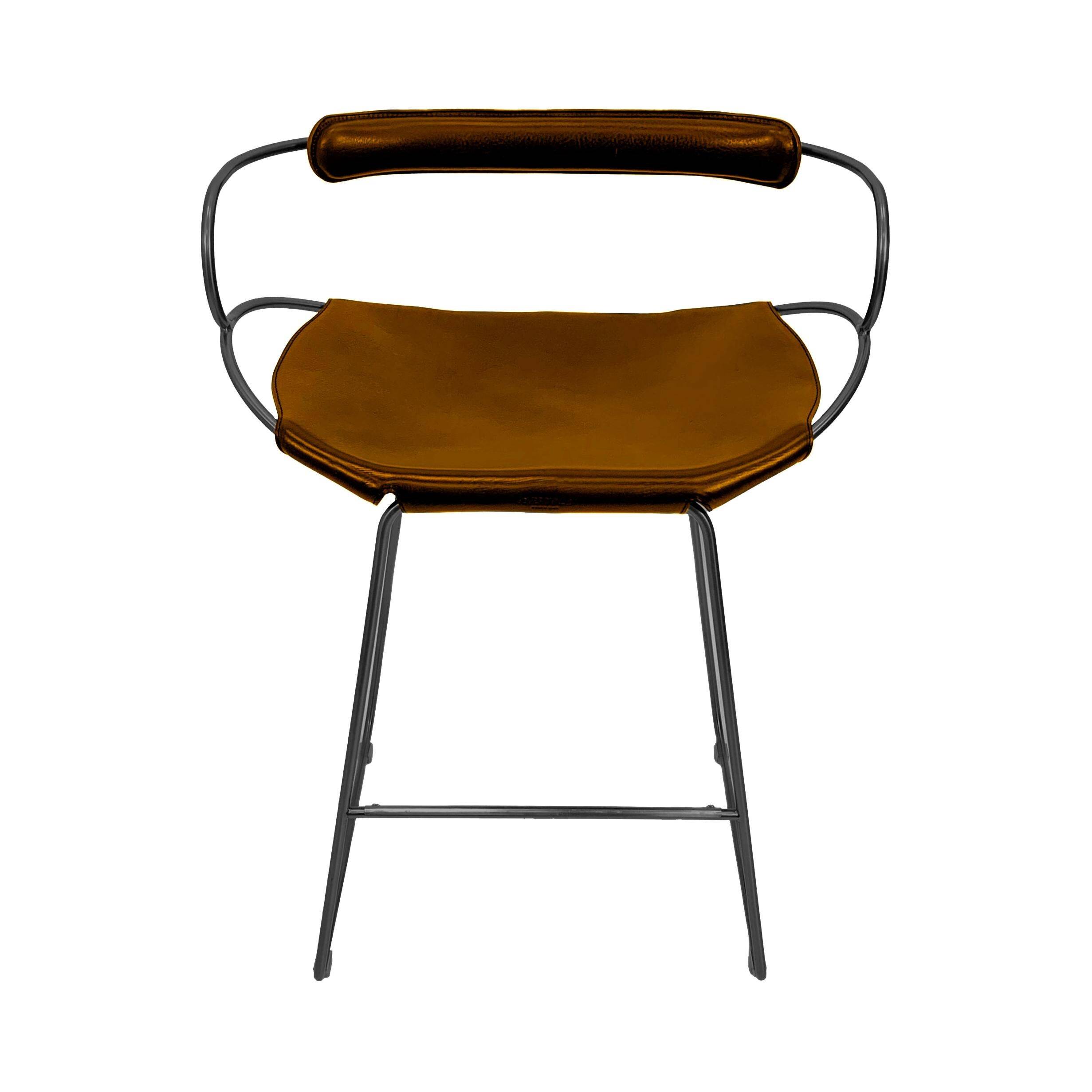 Kitchen stool with a smoked black metal backrest and natural tobacco leather.
