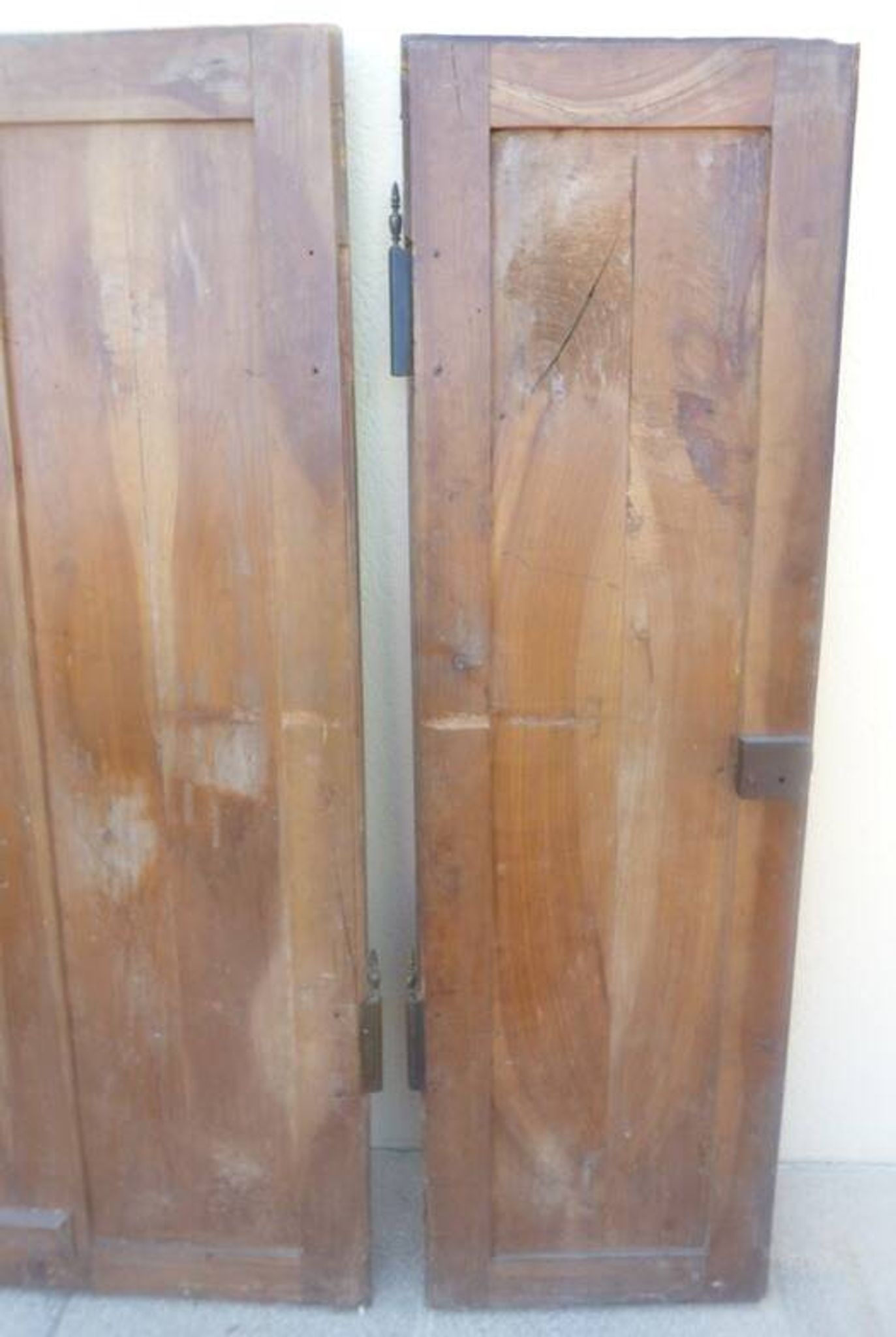 Pair of antique cherry wood cabinet doors from the 19th century in their original part