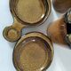 Pair of glazed stoneware cups with saucers and lids