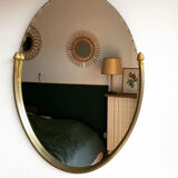 Beveled wall mirror with gold frame