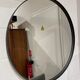 Round mirror 75cm in diameter with a black frame.