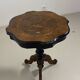 Two-tone black and mahogany pedestal table with mahogany veneer