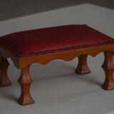 Danish sculpted oak stool from the mid-20th century with a red leather seat, 1950s.