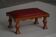 Danish sculpted oak stool from the mid-20th century with a red leather seat, 1950s.