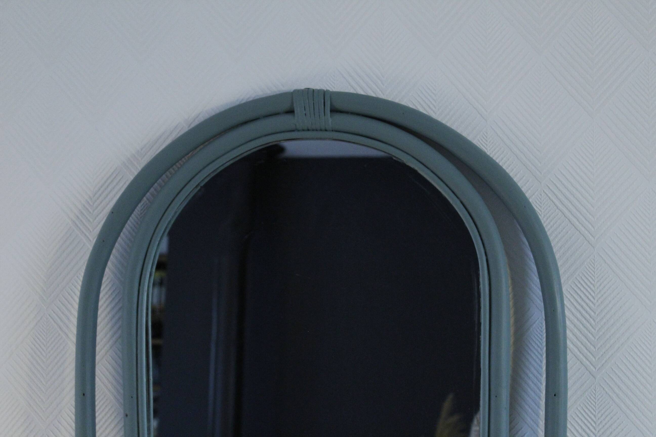 Sage green painted rattan mirror