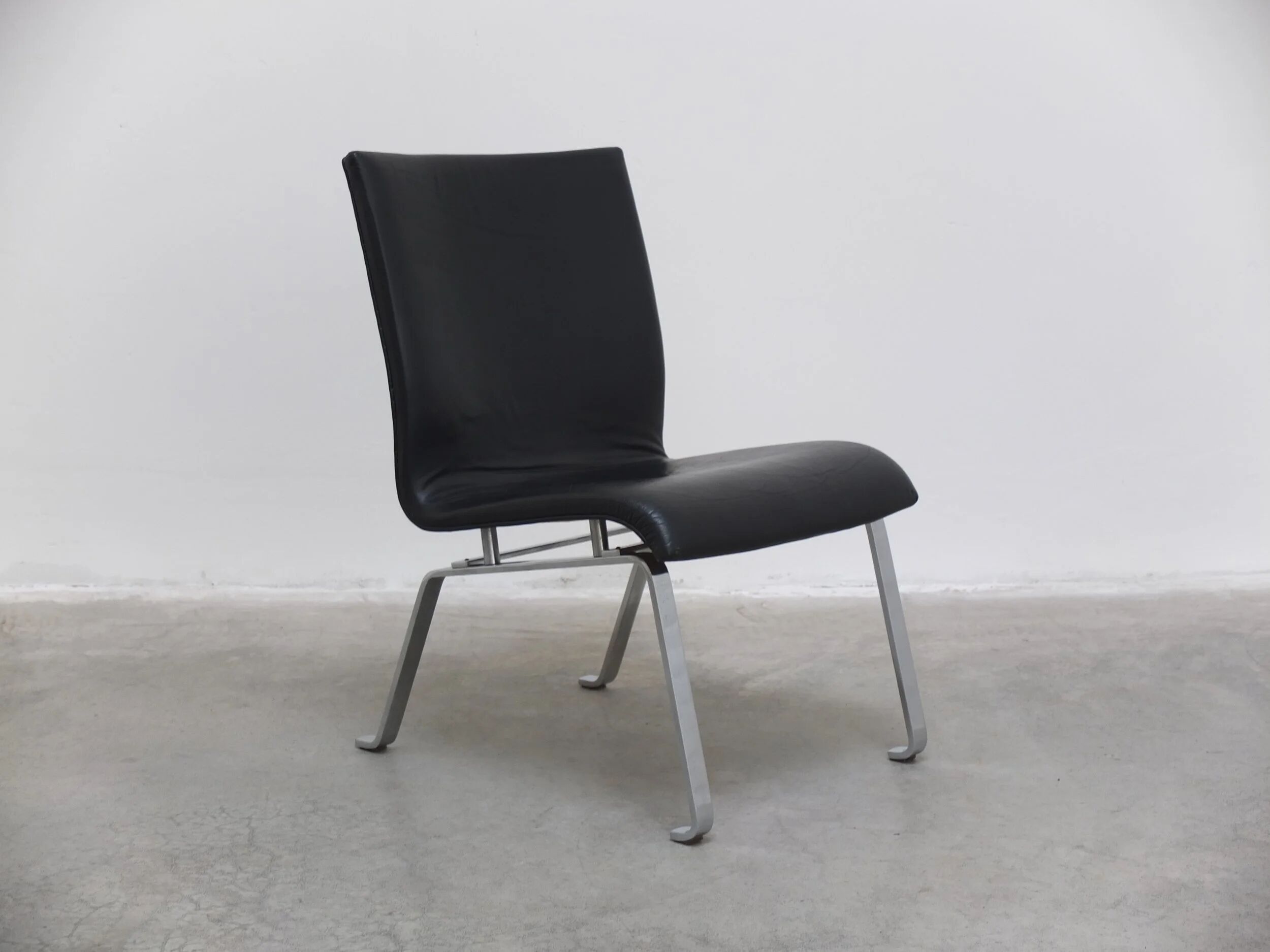 Unique black leather & steel modernist lounge chair, 1960s