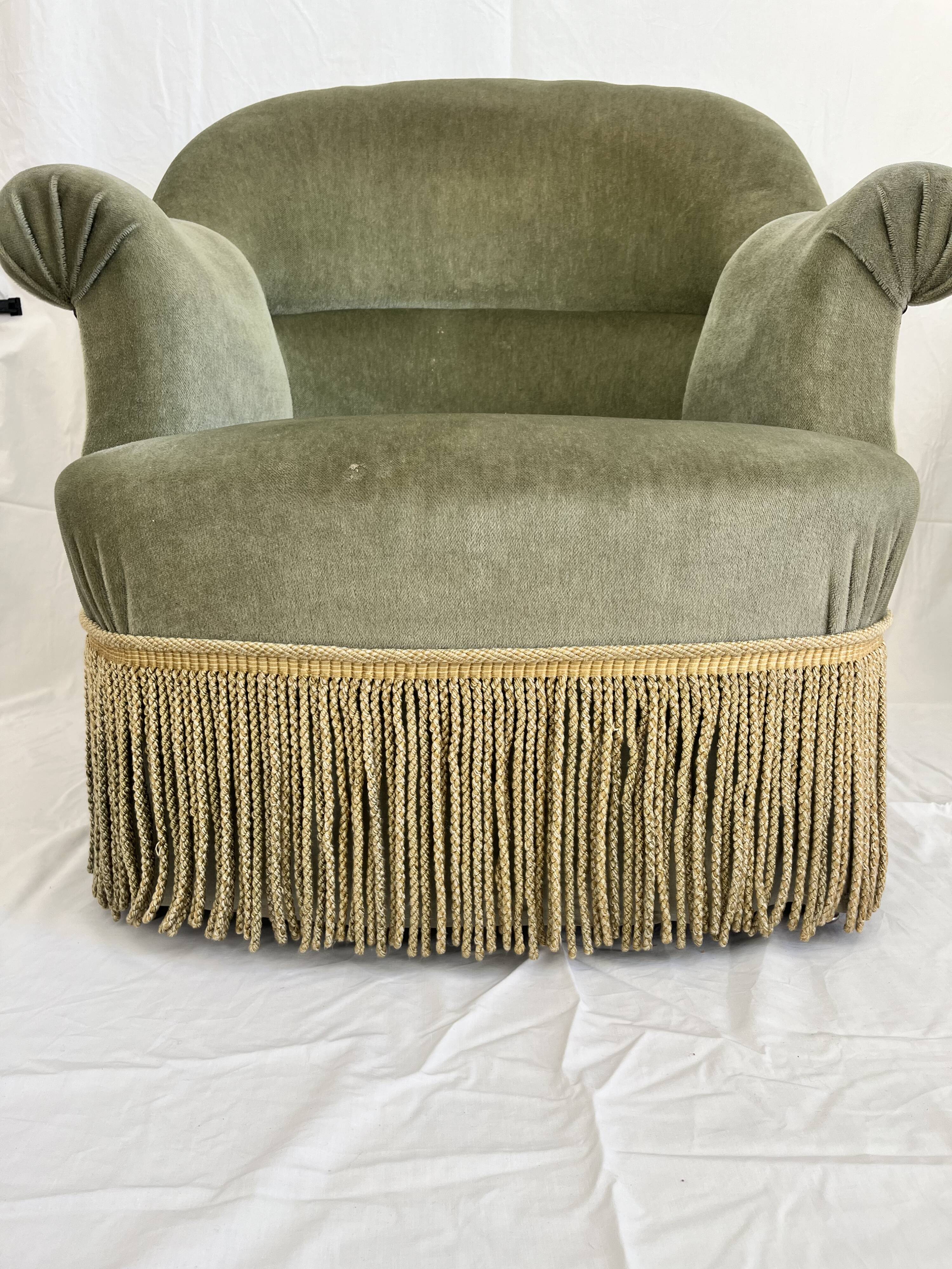 sage green toad armchairs with gold fringe