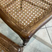 Pair of antique caned and wooden chairs from the 1900s.