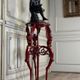 Athenian carved wood, red patina imitation of red marble