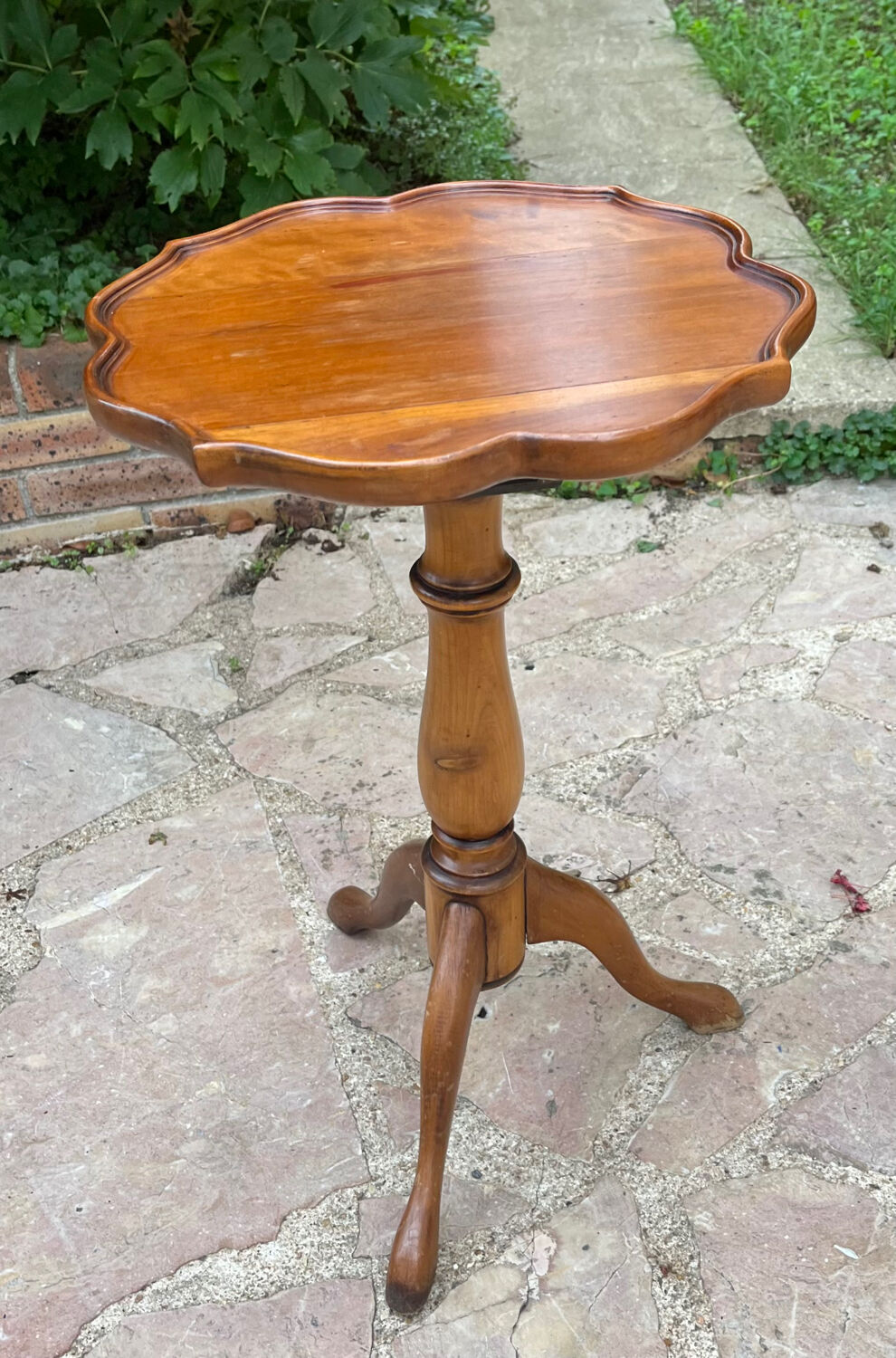 Small wooden pedestal table