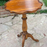 Small wooden pedestal table