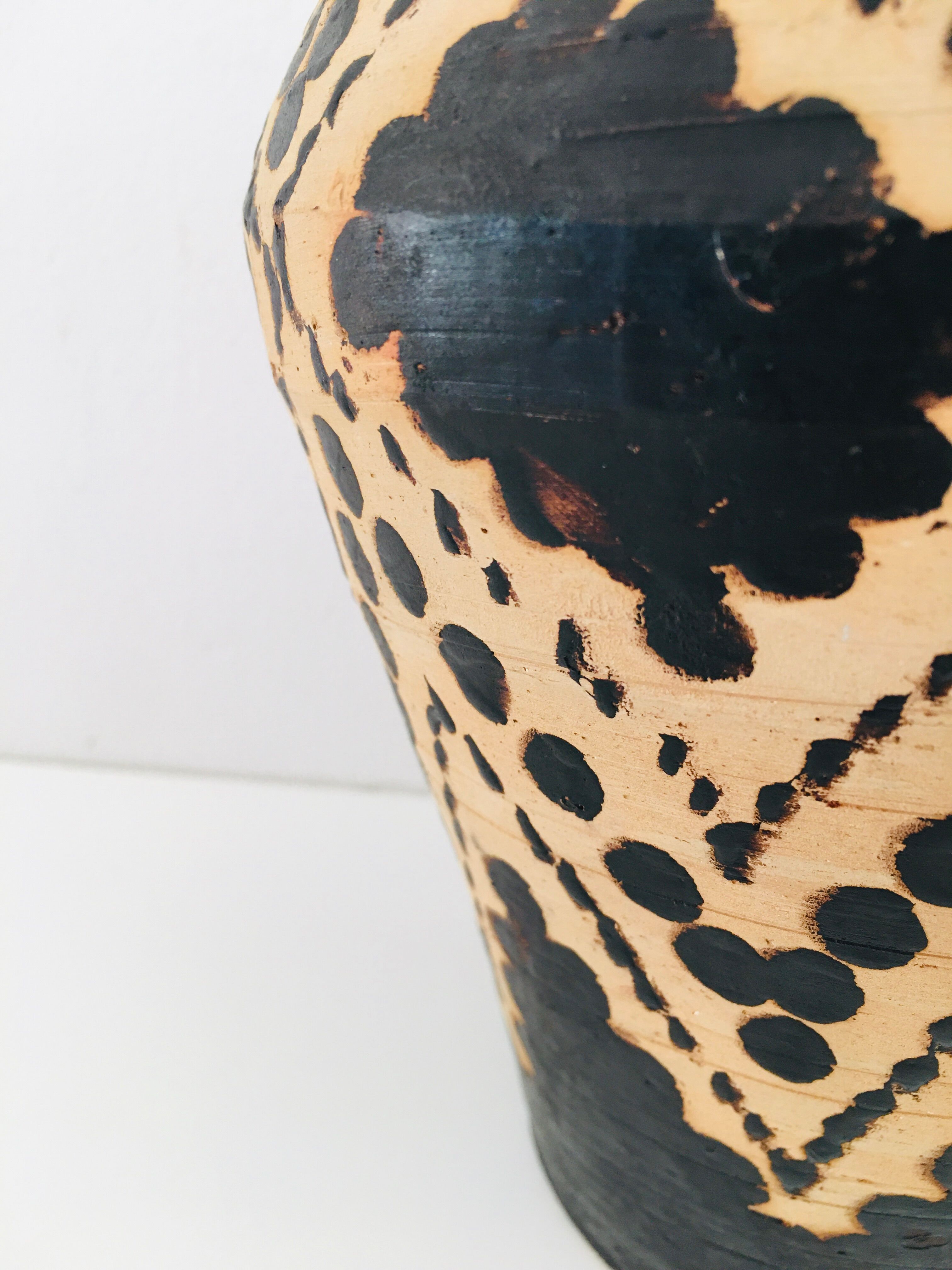 Raw and black terracotta jug