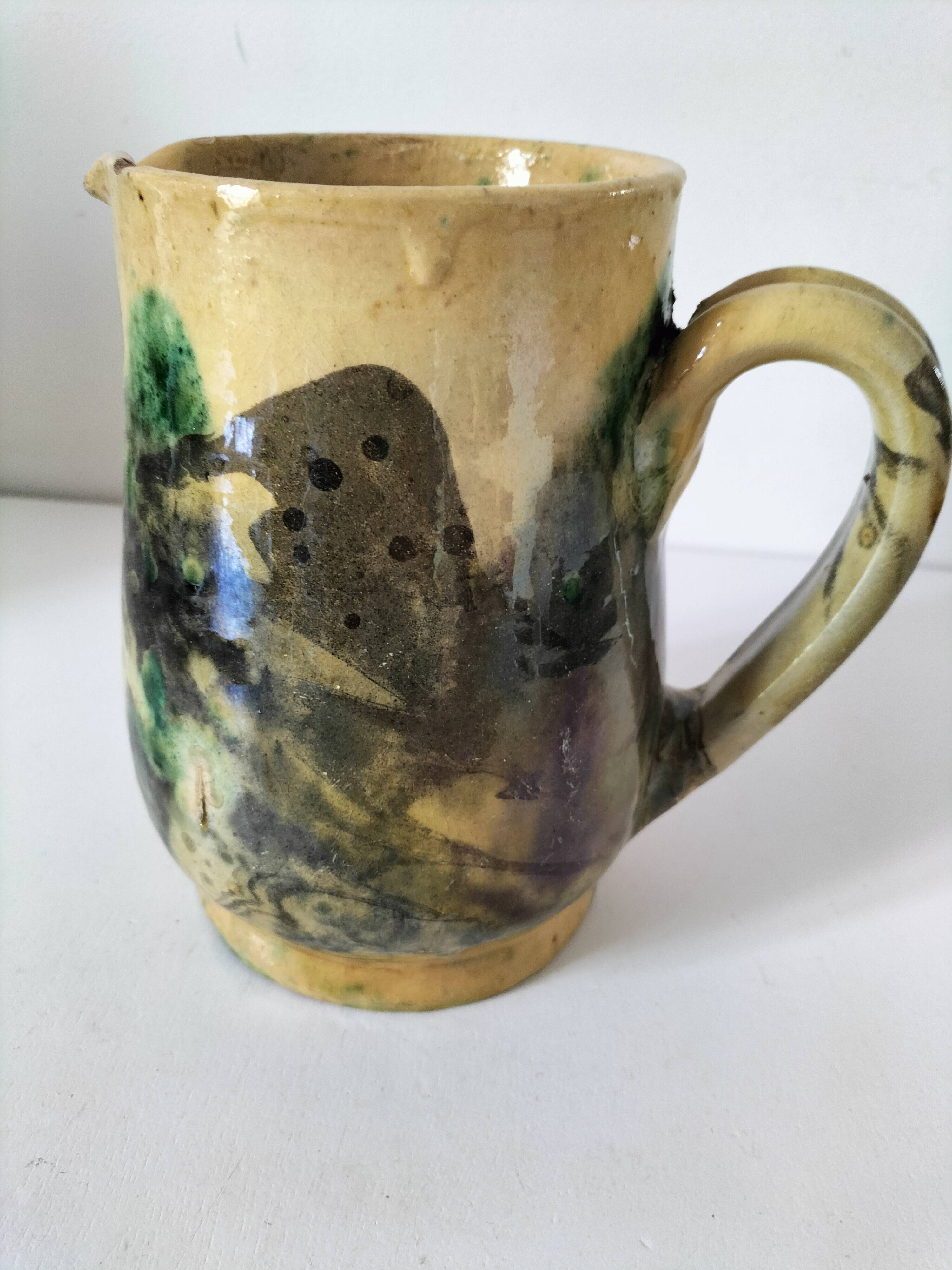 Glazed earthenware pitcher with abstract polychrome decoration, handmade.