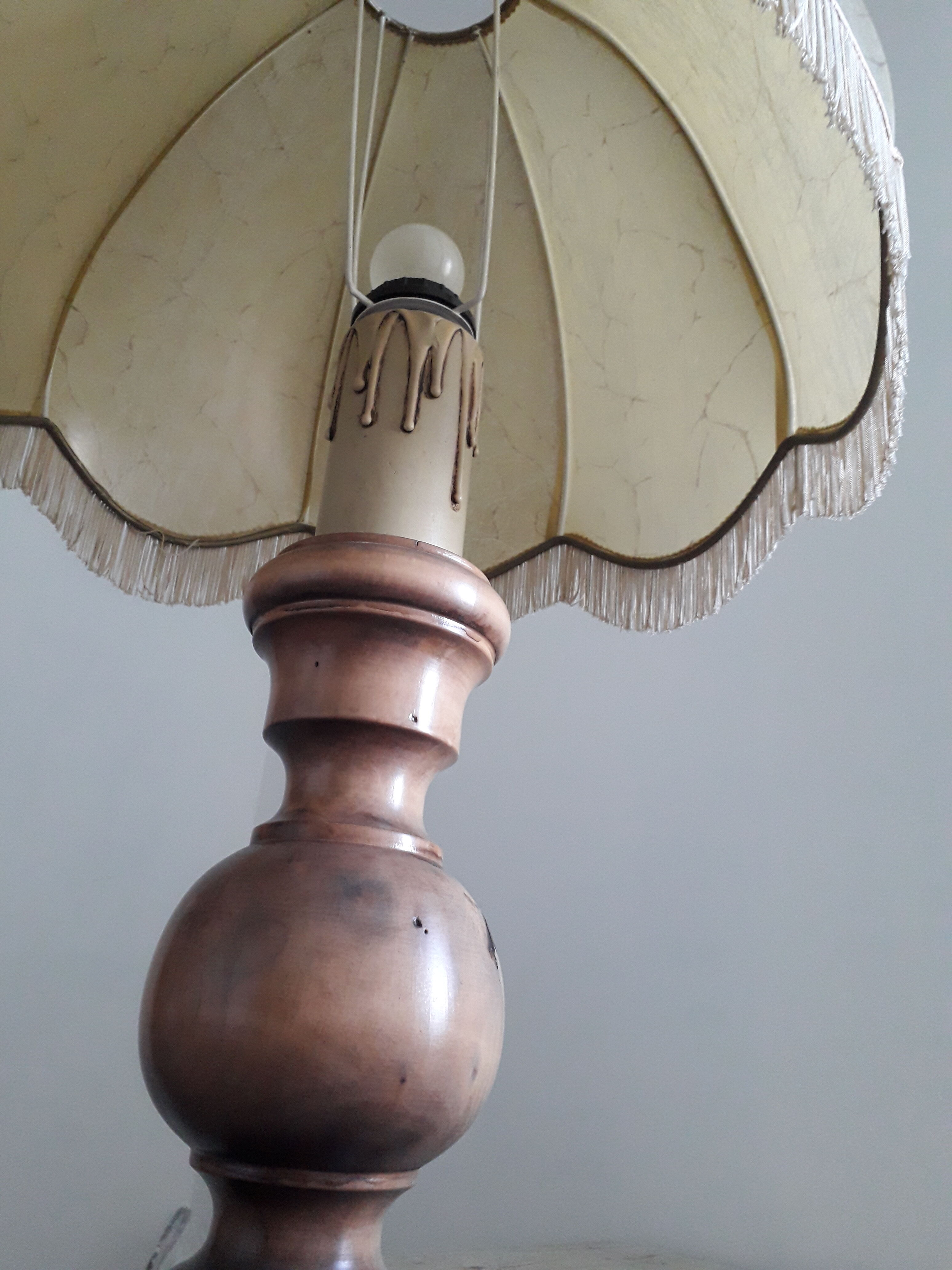 Turned wood table lamp with “skin” shade