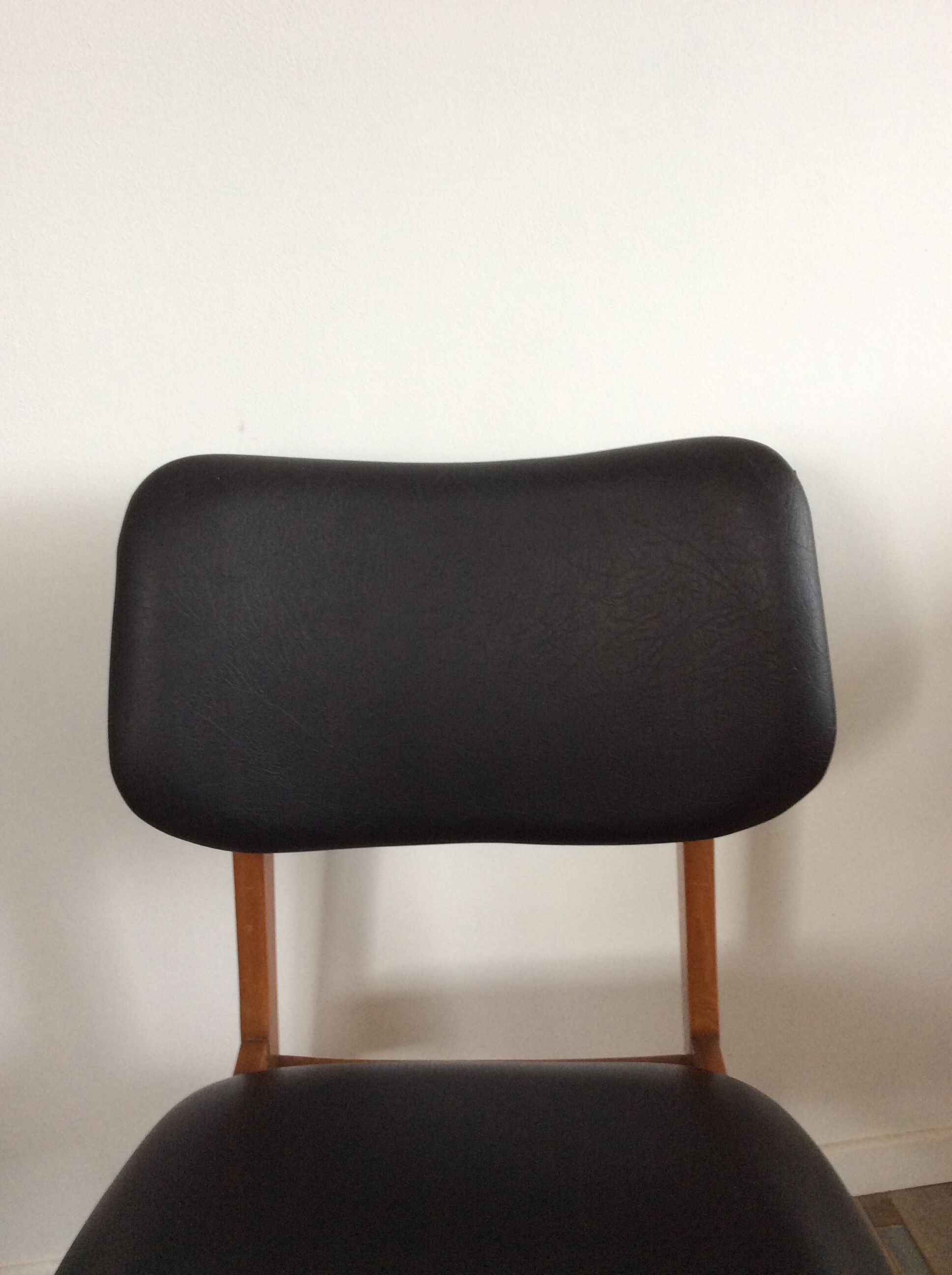 Scandinavian chair of the 60s in teak and black skaï