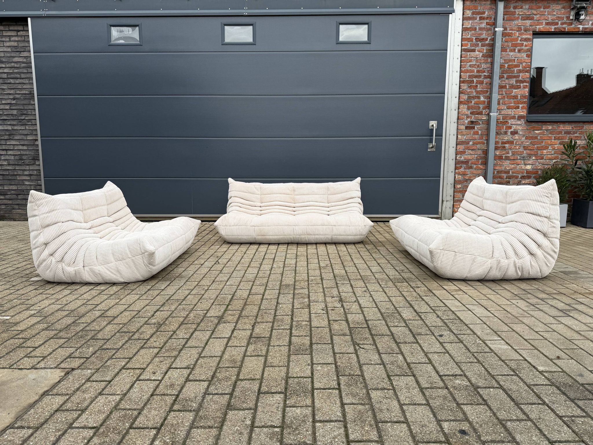 Ligne Roset Togo 3-seater and 2 x 2-seaters in beige corduroy.
