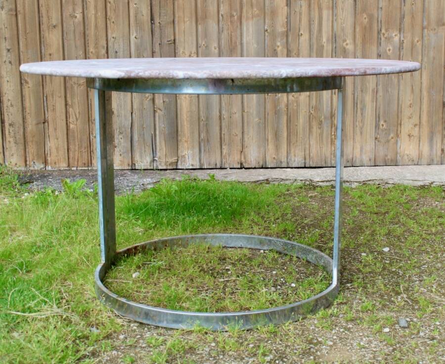 Round marble table with chrome base.