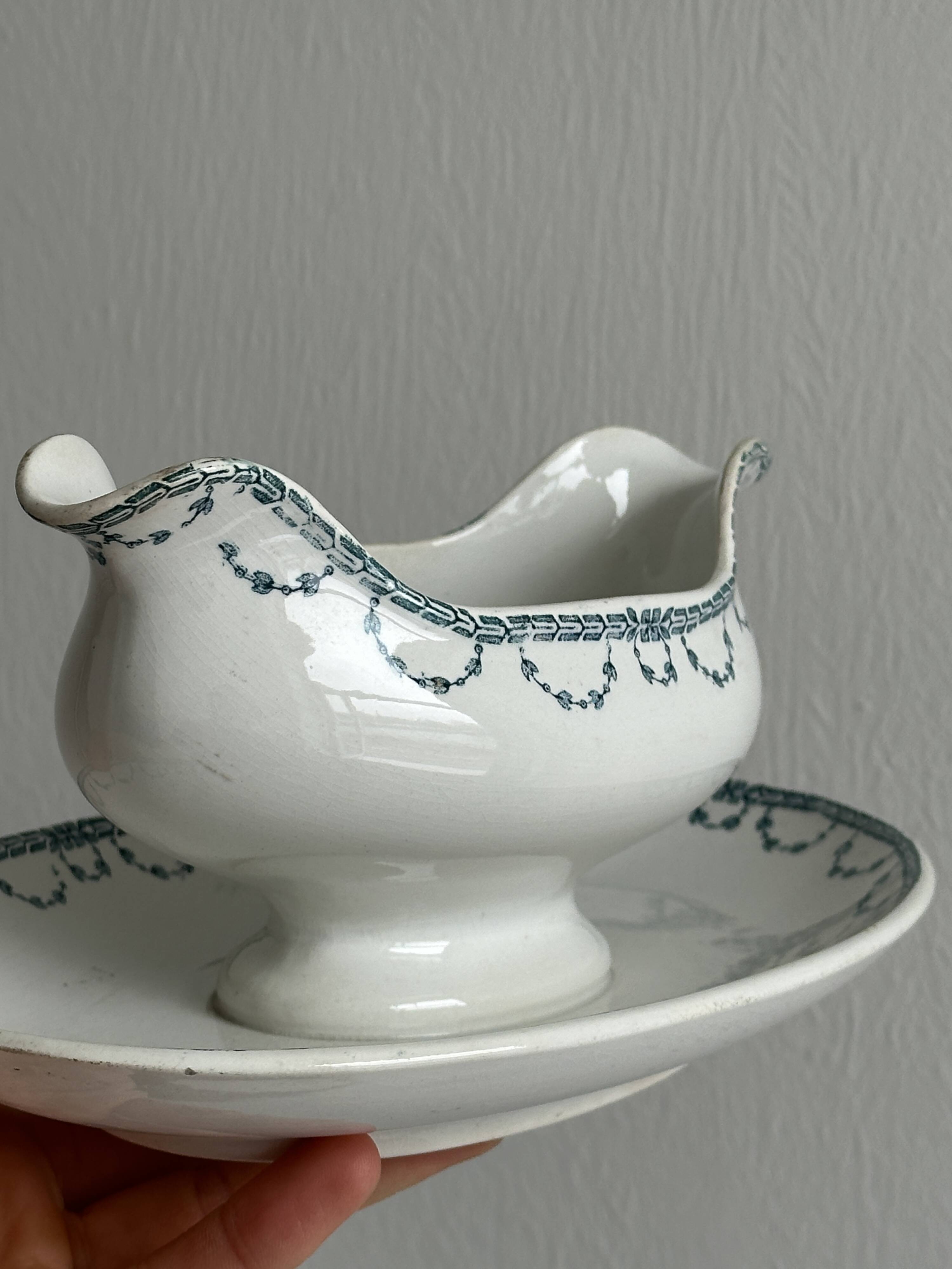 Antique porcelain sauceboat with tray