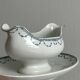 Antique porcelain sauceboat with tray