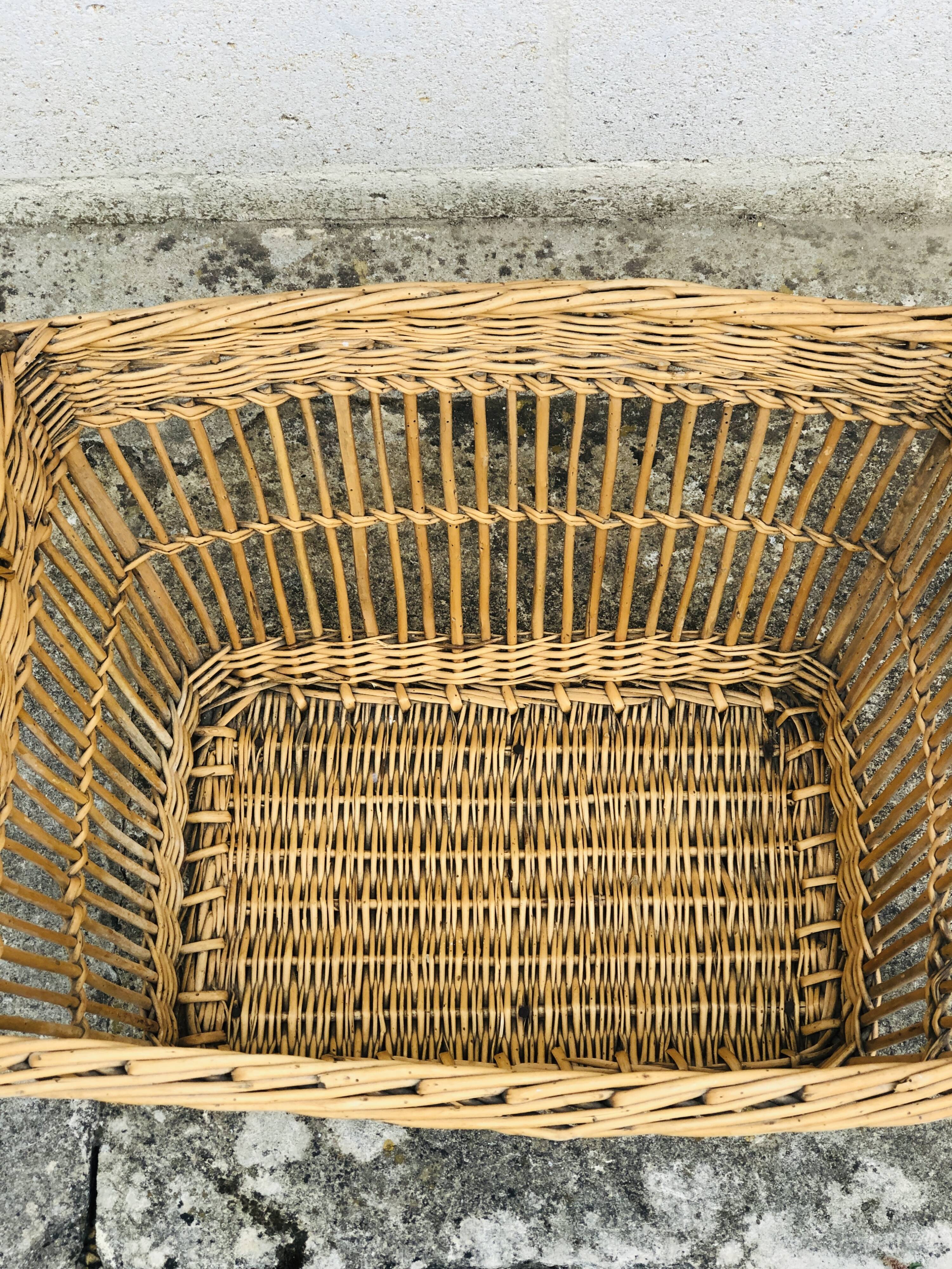 Braided wicker laundry basket