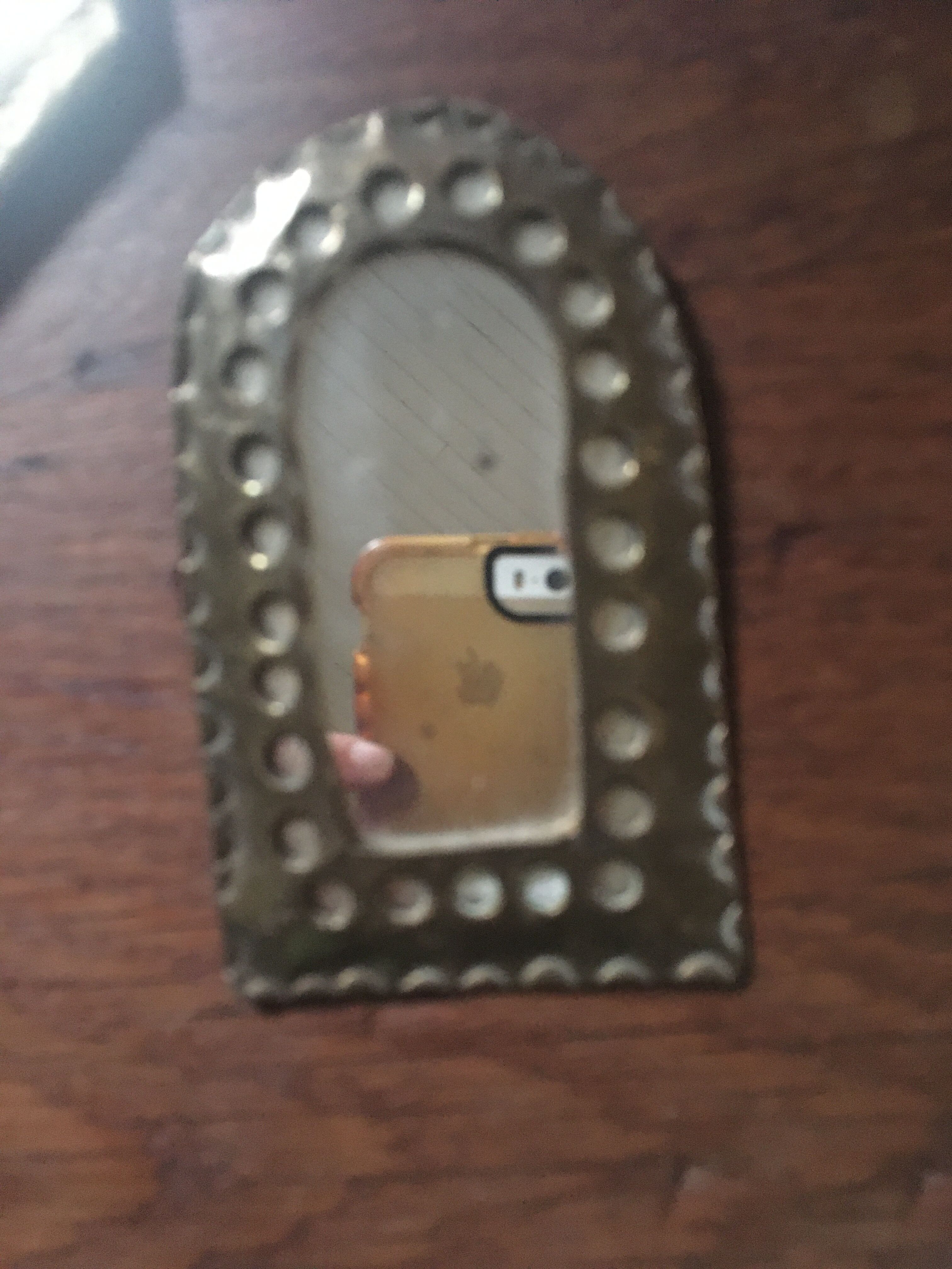 Ethnic brass mirrors.